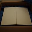 With record mailer, held in place by foam bumpers.